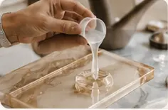 Resin being poured into a handmade piece